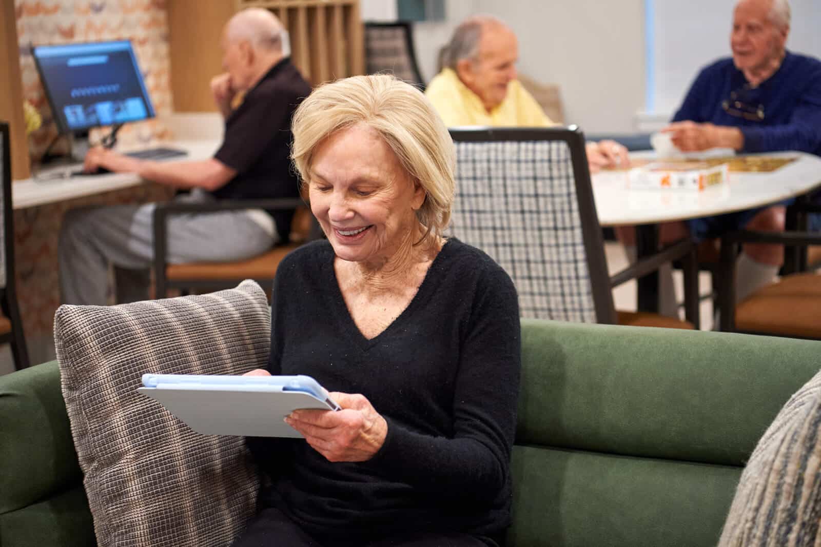 residents enjoying the game room at Longleaf Bee Cave