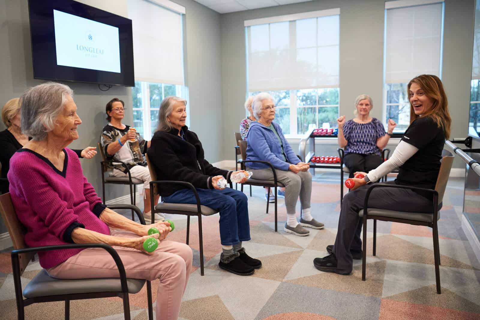 residents performing chair exercises