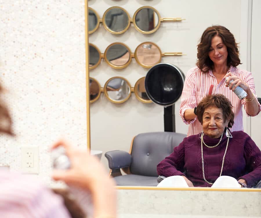 Resident getting her hair done in the salon