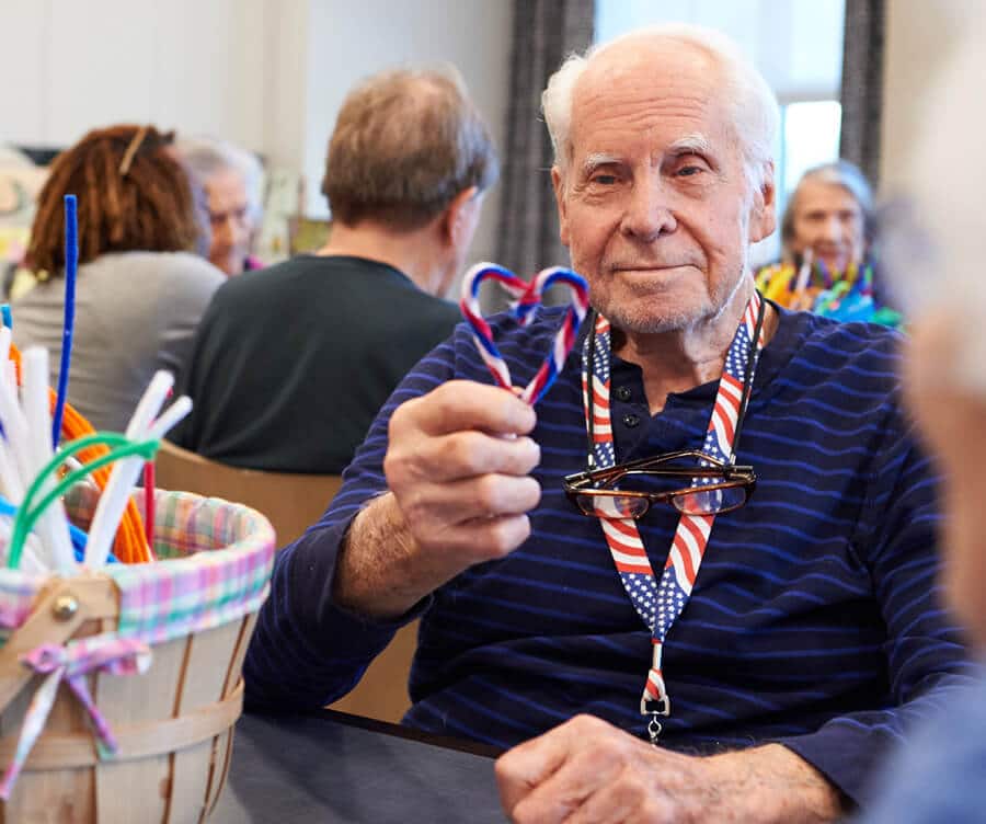 resident doing crafts at Longleaf Bee Cave