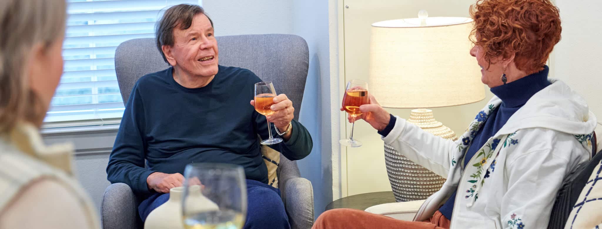 residents enjoying a glass of wine